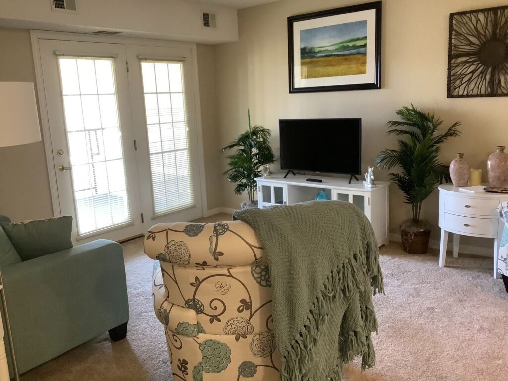 living room with tv in senior living residence
