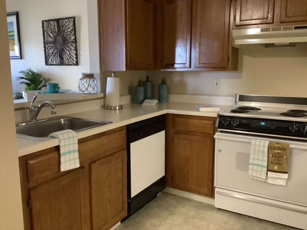 kitchen with brown cabinets in senior living residence