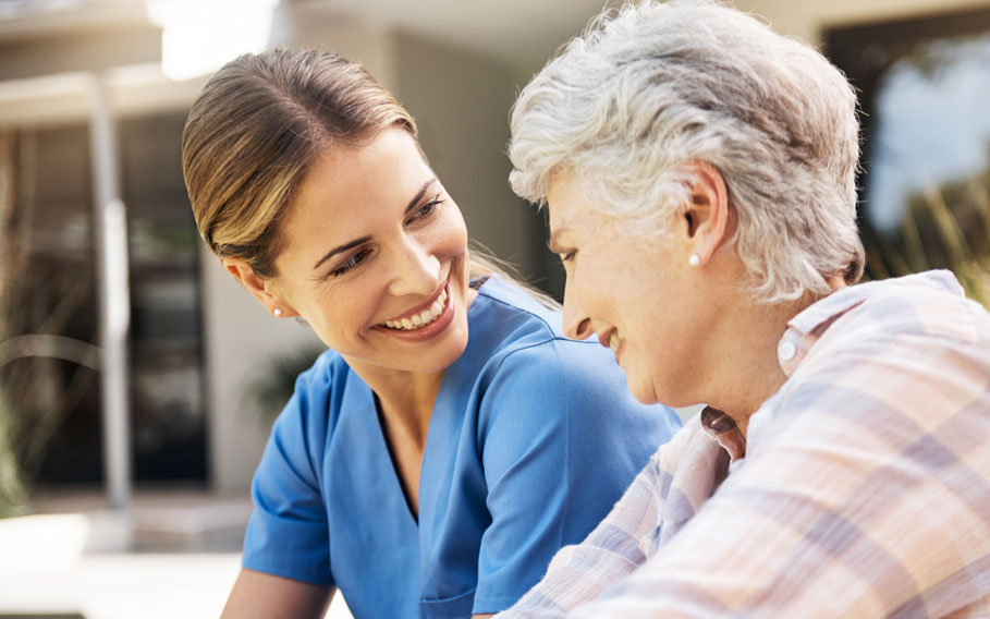 senior lady with caregiver outside